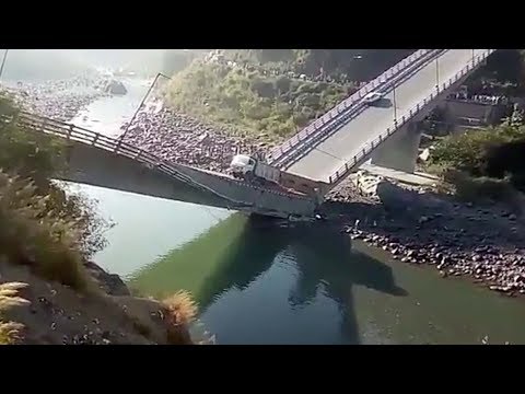 after bridge collapses breaks in two