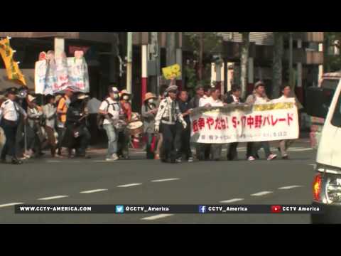 tokyo demonstrations oppose changes to military