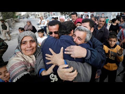 syrian hostages who fled isil return home