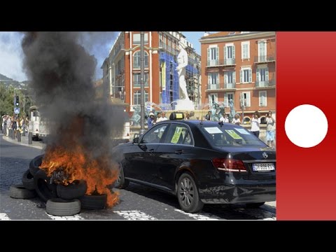 protesting taxi drivers smash up car