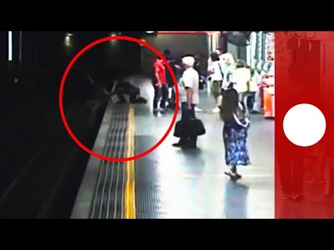 police pull suicidal woman from train tracks