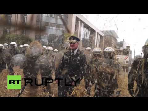 furious farmers throw hay firecrackers at police